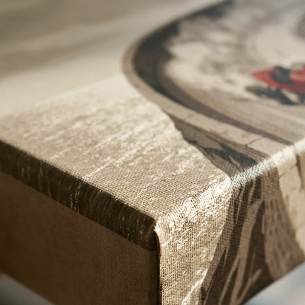 Corner of a gallery-wrapped canvas print showing texture and deep wrap